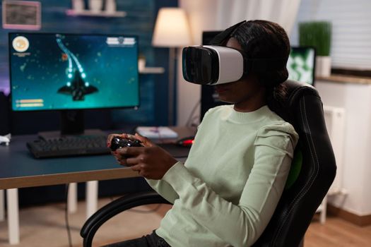 Pro gamer woman wearing virtual reality headset holding gaming joystick