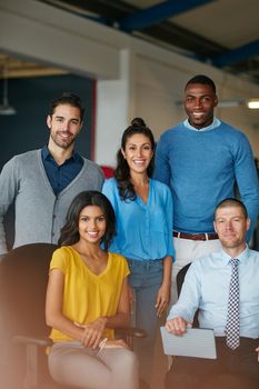 Were the best team for the job. Cropped portrait of a group of businesspeople standing in the office.