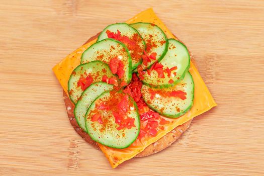 Crispy Cracker Sandwich with Fresh Cucumber, Cheese and Paprika
