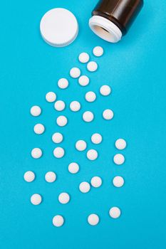 Pharmaceutical Industry and Medicinal Products - White Pills on Blue Background