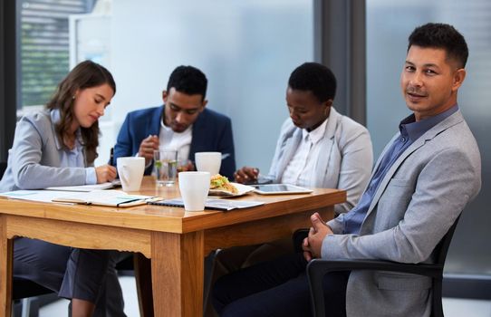 Its important that team members hear out one anothers opinions. Shot of a group of colleagues having a meeting and breakfast in a modern office.
