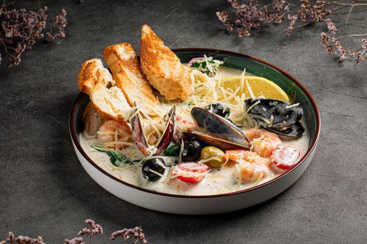 Portion of seafood saute with wheat bread