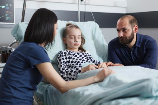 Restless uneasy careful parents conversating about little girl illness evolution
