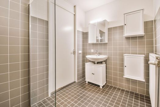 Bathroom with brown tiles