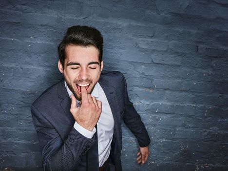 This is what I think of your ideas. Shit of a business man sticking his finger down his throat against a grey wall.