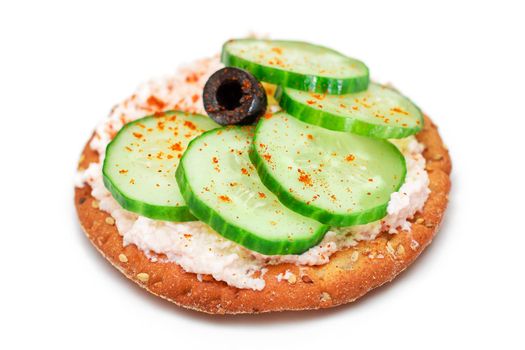 Crispy Cracker Sandwich with Fresh Cucumber, Fish Cream and Olives - Isolated