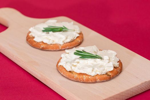Crispy Cracker Sandwich with Cream Cheese and Rosemary
