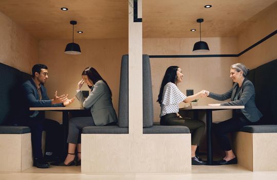 When one door closes, another usually opens. Full length conceptual shot depicting the contrast between a businesswoman being hired and a businesswoman being fired.