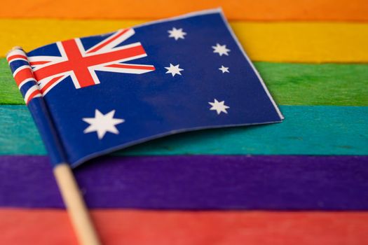Australia flag on rainbow background flag symbol of LGBT gay pride month  social movement rainbow flag is a symbol of lesbian, gay, bisexual, transgender, human rights, tolerance and peace.