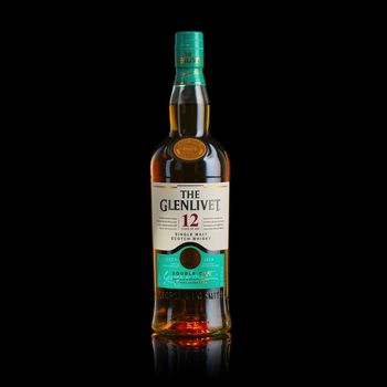 Tallinn, Estonia - March, 2022: A Glenlivet 12 years single malt scotch whiskey bottle.