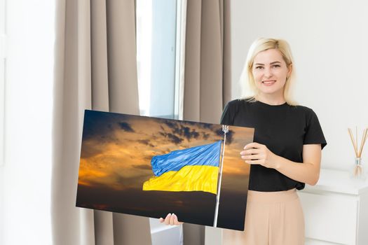 Blue and yellow flag of Ukraine paints on a canvas, national flag of Ukraine