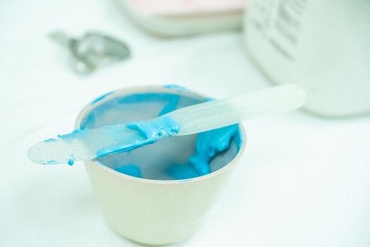 bowl with alginate paste for dental impressions