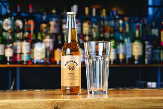 Beer bottle mock-up against blurred bar counter