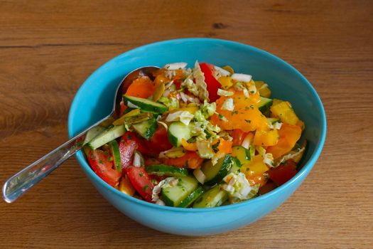 A plate with bright and delicious vegetables, a light salad.