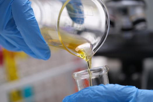 Chemical laboratory research and liquid oil processing closeup