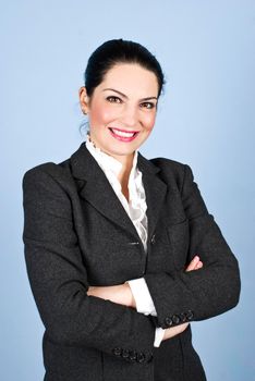 Happy executive woman with arms folded