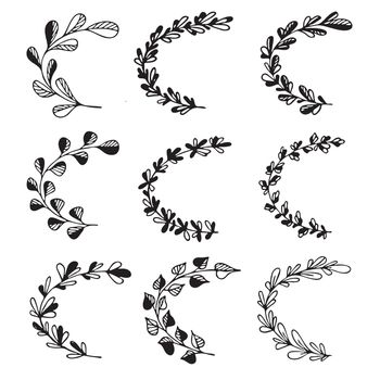 Set of hand drawn doodle tree branches with leaves on white background