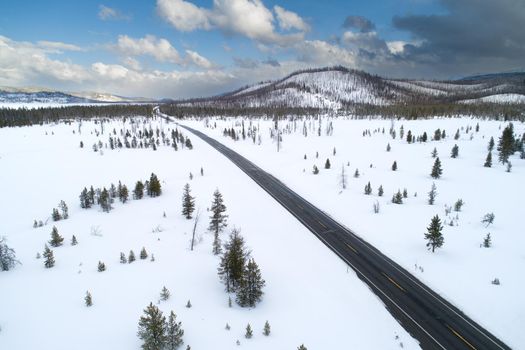 aerial view of a road with melted snow after a storm