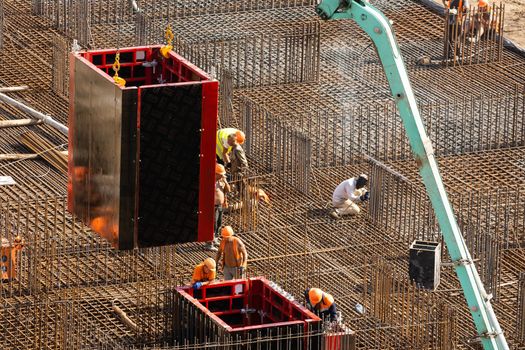 workers working with concrete irons in a construction site
