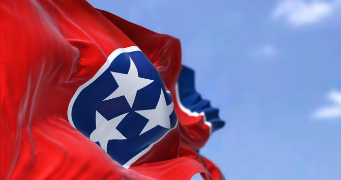 The US state flag of Tennessee waving in the wind