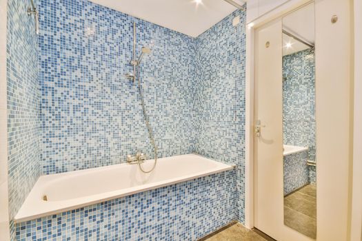 Small bedroom tiled with blue tiles