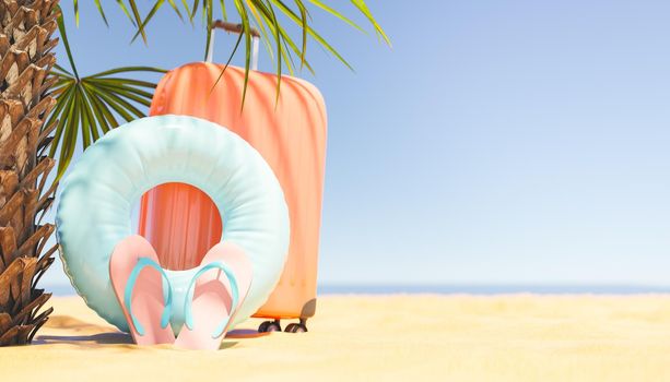 Suitcase and inflatable ring on beach
