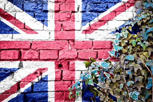 United Kingdom grunge flag on brick wall with ivy plant