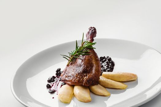 Food. Duck leg with pear and currant sauce. Delicatessen Gourmet Restaurant Menu Concept