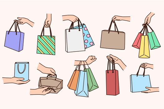 Set of people holding shopping bags