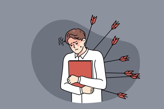 Stressed employee with arrows in back