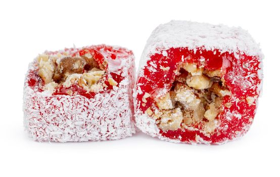 Red Turkish delight with nuts in powdered sugar isolated on white