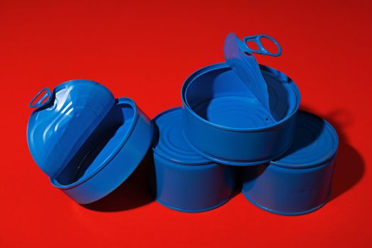 Blue tin can on dark red background