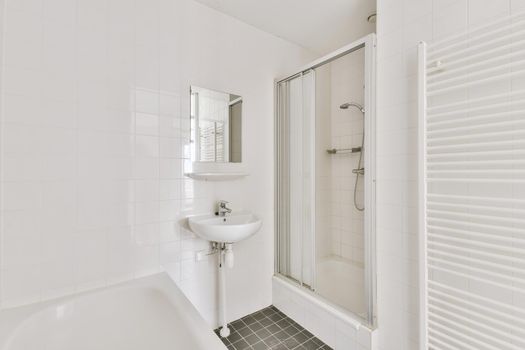Bathroom with white and black tiles