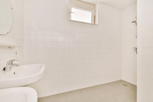 Interior of a bathroom with white tiles