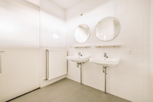 Interior of a bathroom with white tiles