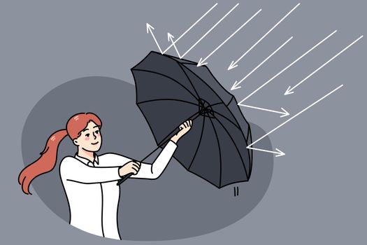 Businesswoman use umbrella protect form rain