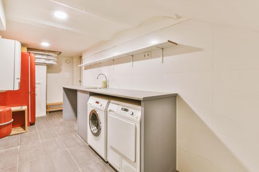 A small laundry room with appropriate appliances