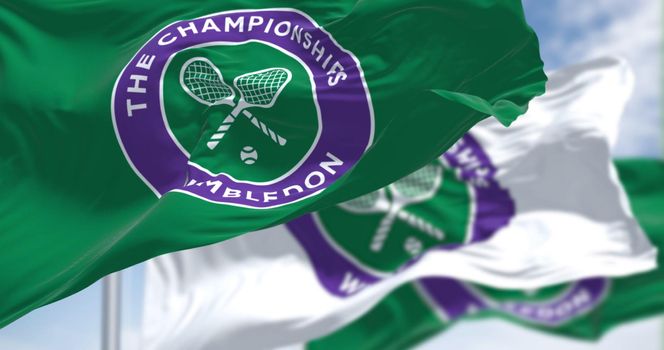 London, UK, April 2022: three flags with the The Championships Wimbledon logo waving in the wind