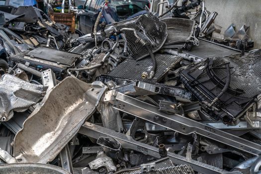 parts of dismantled cars at the car wreck