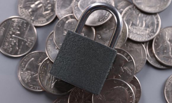 Padlock on coins, financial security and protection finance