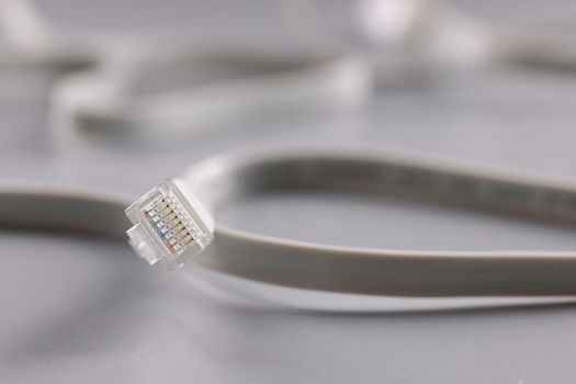 Internet connectors on grey background, cable with plastic clip