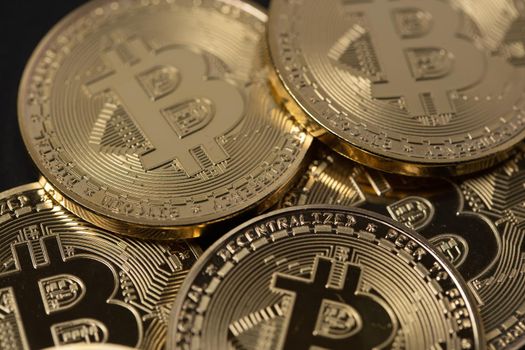 Cryptocurrency coins, Golden Bitcoin coins closeup. Digital currency. Blockchain and decentralized Money