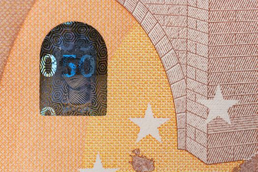 Closeup of 50 Euro banknote, Design of new 50 Euro Bills. European Money Fifty Euros. European Monetary Union. Hologram safety feature on paper money