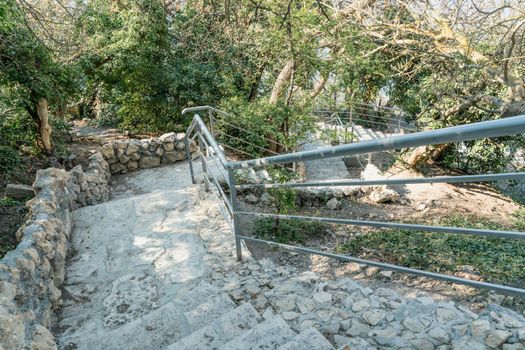 A new stone staircase of 800 steps to Jasper Beach, built in the spring of 2020. The reserve on the Black Sea. Cape Fiolent, Crimea Peninsula. The concept of unity with nature, outdoor activities.