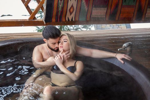 couple bathing in a vat