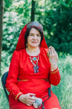 the senior priestess with a butterfly on her fingers prepared for the rite of sacrifice. mystical pagan rite. pagans today.