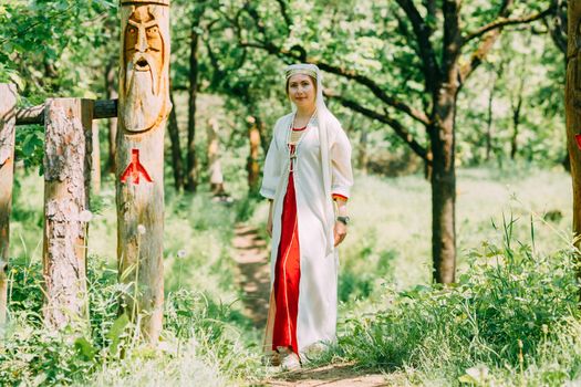 happy woman pagan priestess prepared for the ceremony. old faith in our time. seasons, summer.