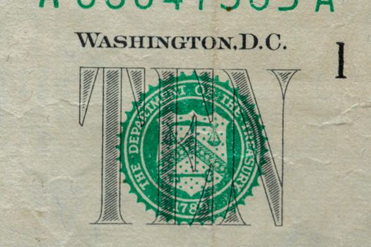 Ten dollar banknotes. Closeup of 10 US dollar bills. Money as background. TEN writing on banknote