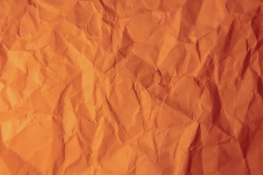 Crumpled orange paper. 