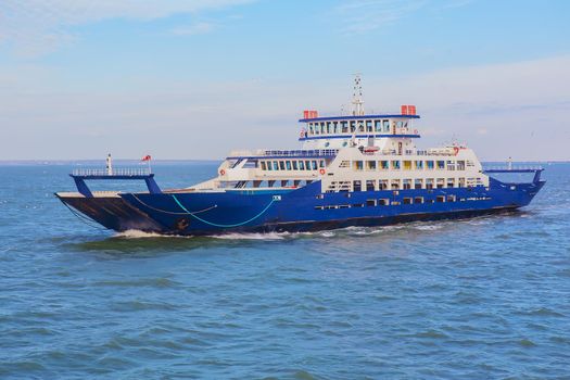 Sea freight ferry moves along the sea 